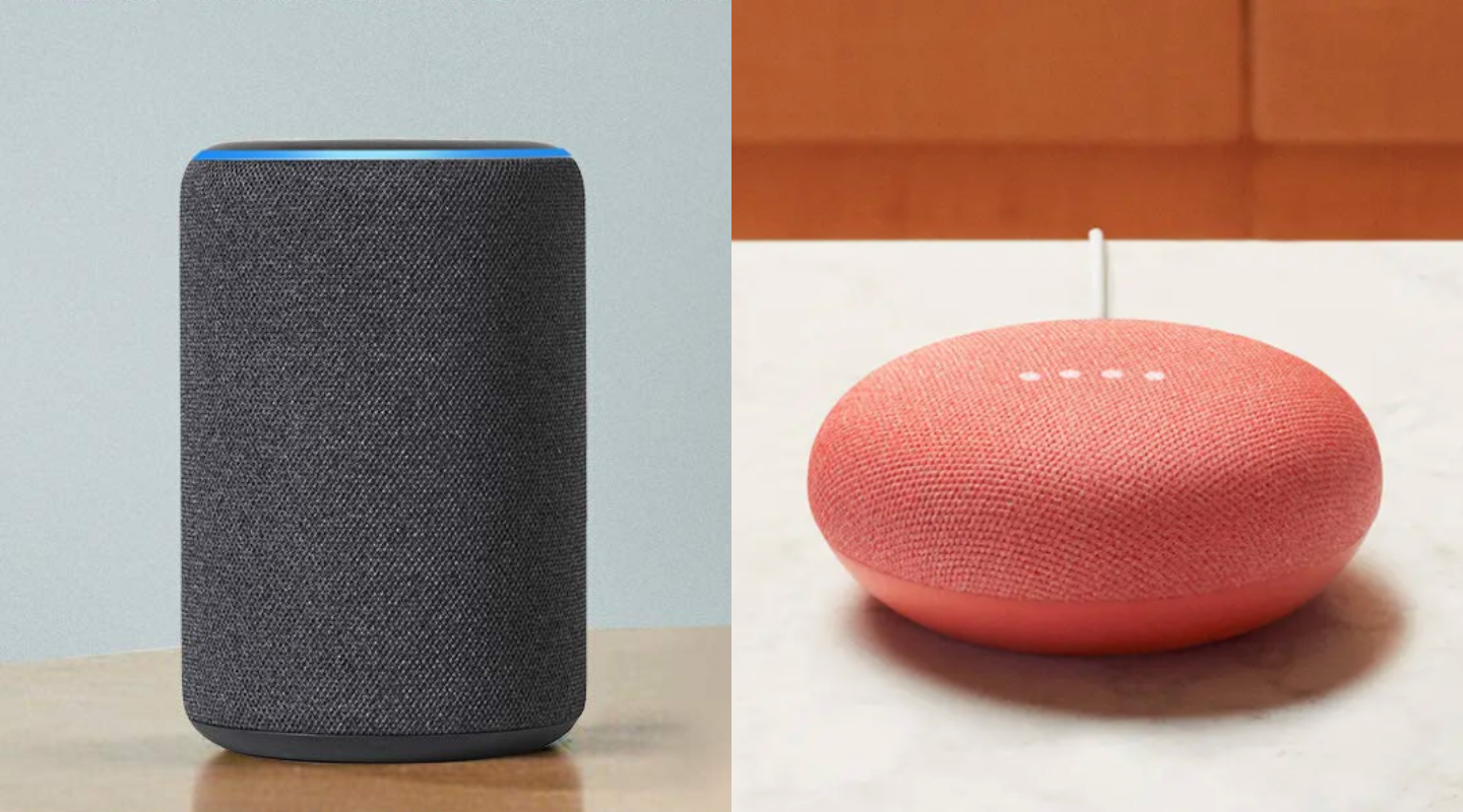 An Amazon Echo speaker sits next to a Google Home Mini speaker.