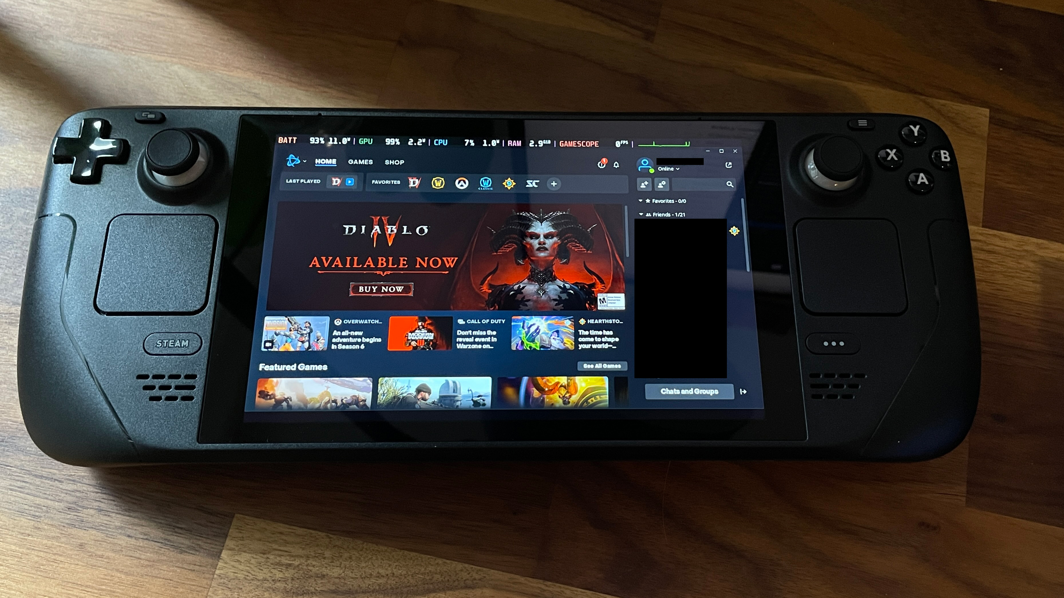 Um convés a vapor na cor preto, com videogame Diablo 4 na tela