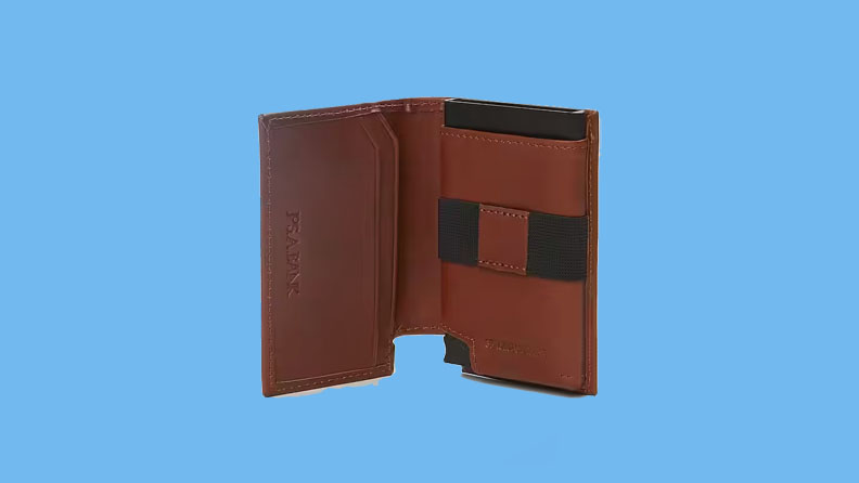 brown leather wallet on a blue background.