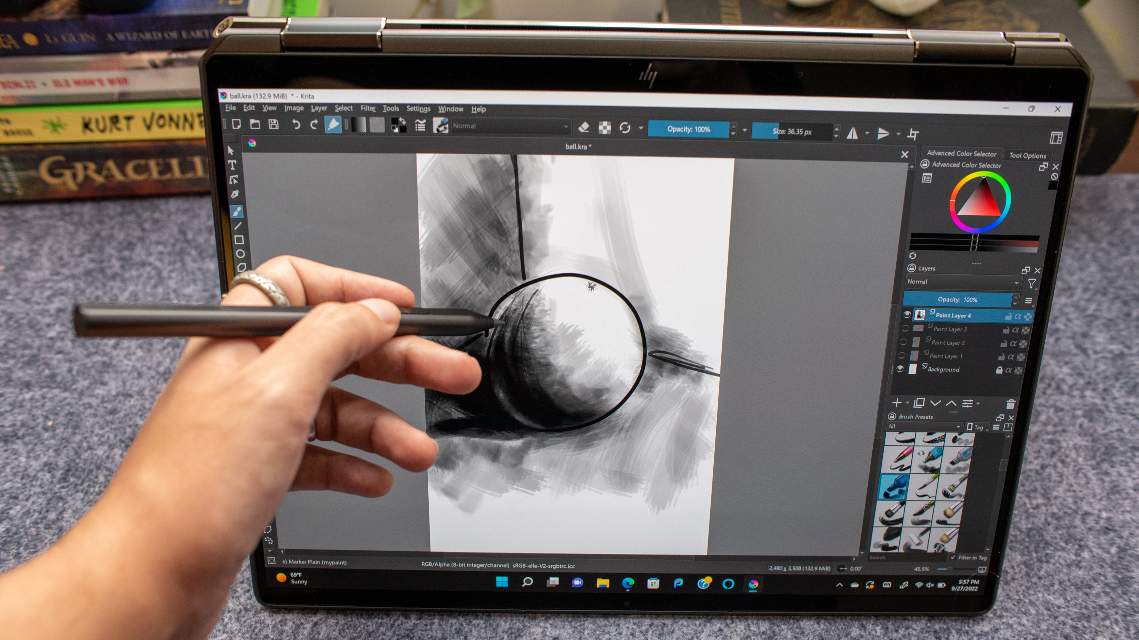 A hand drawing on the laptop