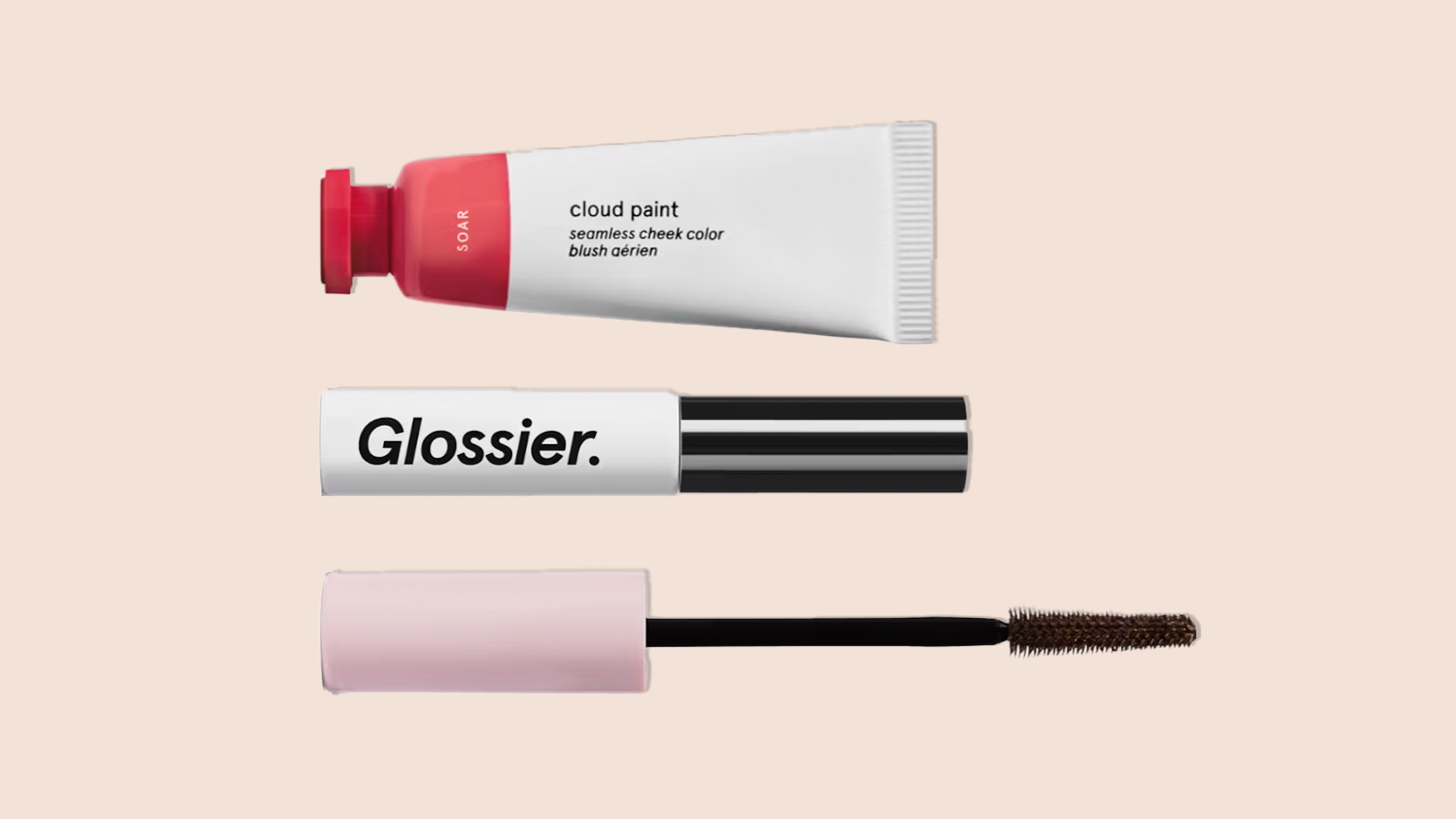 A great gift for girlfriends, the Glossier The Makeup Set on a tan background.