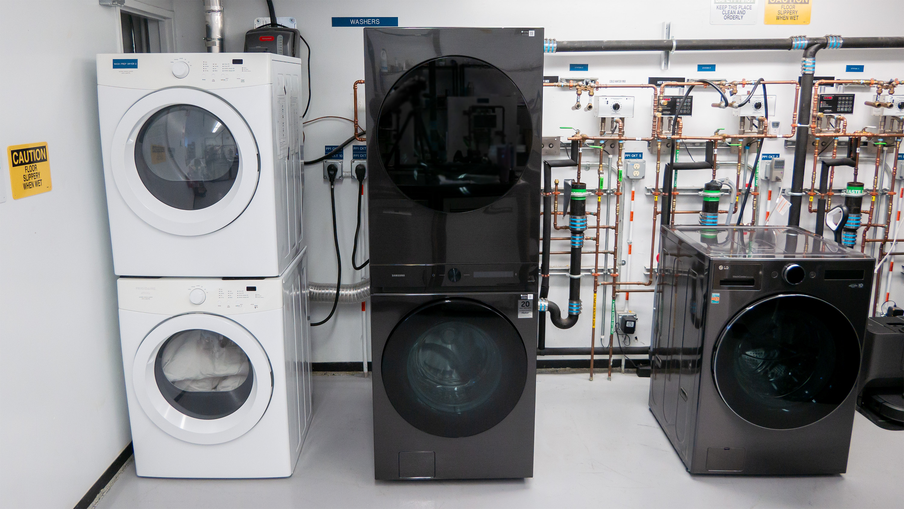 The Samsung Bespoke WH46DBH500EVA3 laundry center next to a stacked dryer and combo unit.